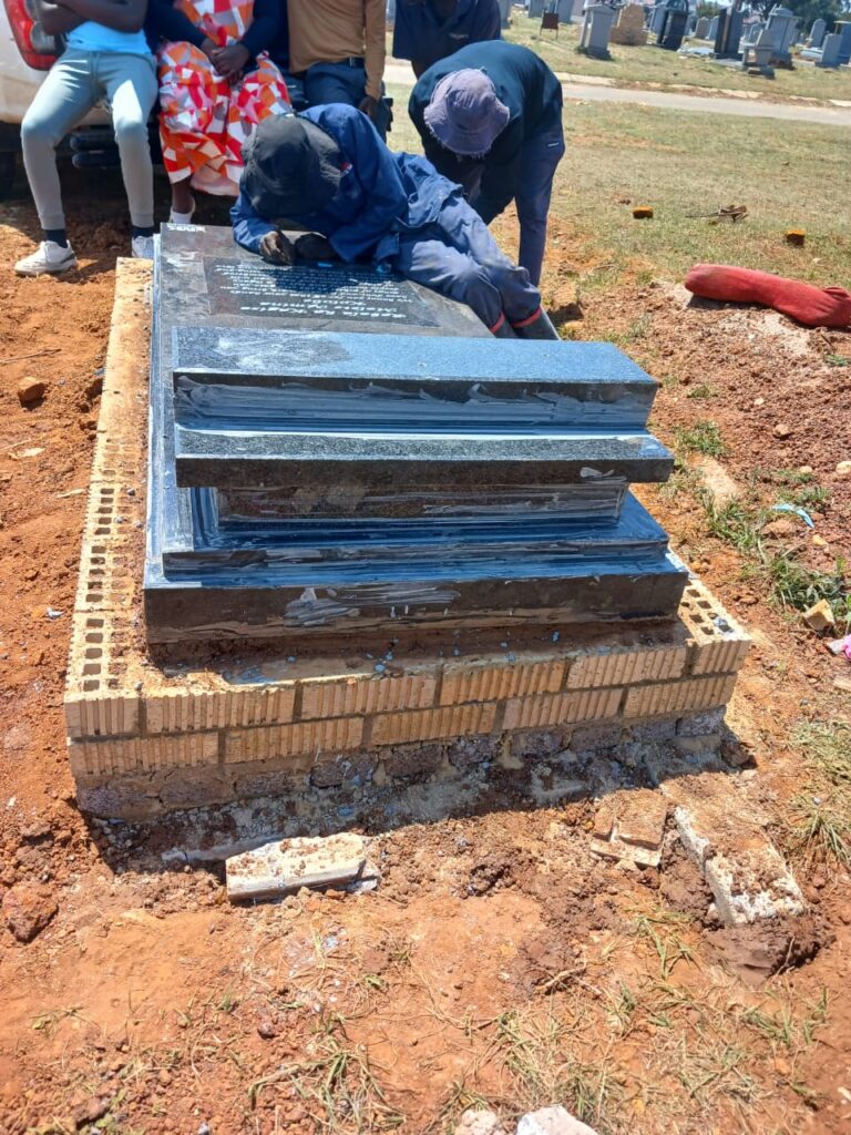 Engraving a tombstone