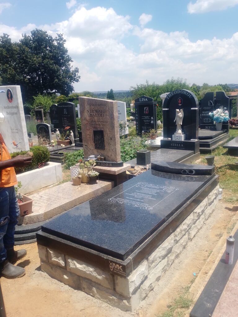 Expert installation of custom granite headstone by Mkhonto Tombstones at prestigious Fourways Memorial Park
