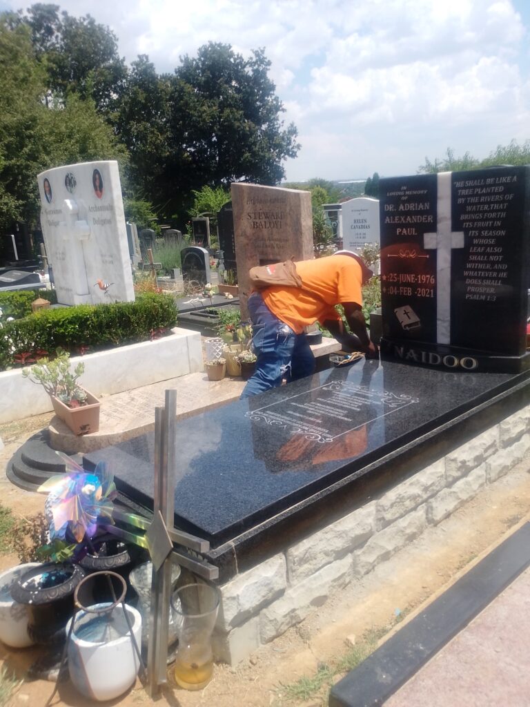 Newly cleaned premium granite tombstone manufactured by Mkhonto Tombstones before final installation at Fourways Memorial Park